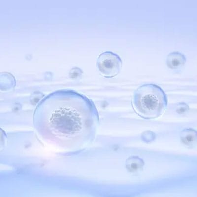 Translucent bubbles float against a soft blue background.
